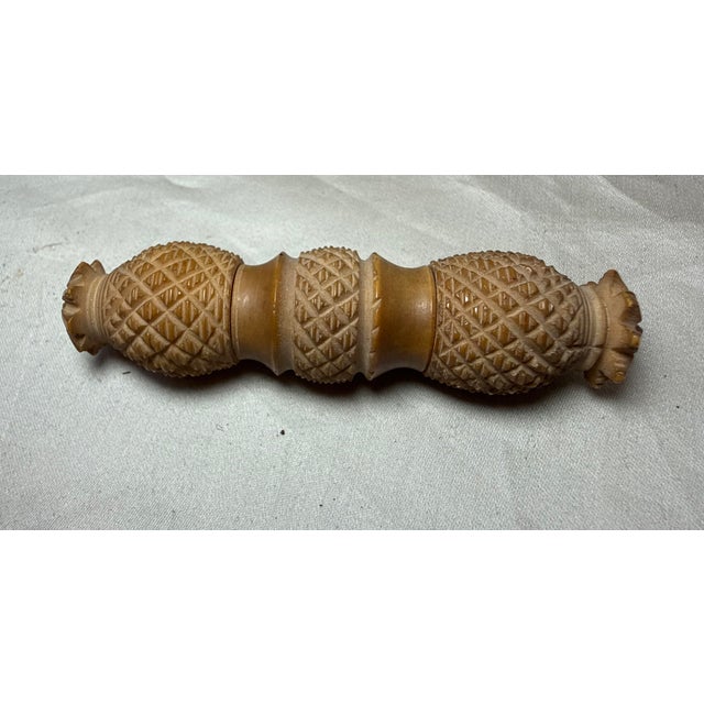 This antique 19th-century sewing needle case is a unique and intricately hand carved piece made from a coquilla nut. The...