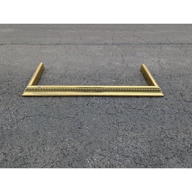 Elevate your hearth with this elegant 19th-century antique brass fireplace fender, a masterful blend of timeless Victorian...