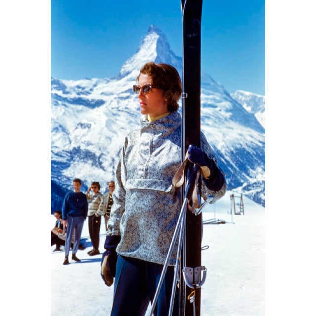 Stylish Skiing by Toni Frissell A stylish skier prepares for her journey down a mountain in Zermatt, Switzerland, 1956....