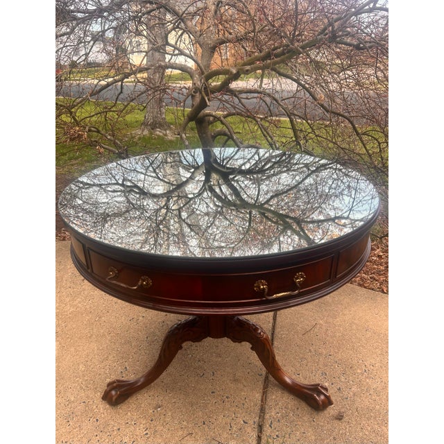 Made by Imperial Furniture. Beautiful antique English Chippendale style center table crafted in mahogany with a tooled...