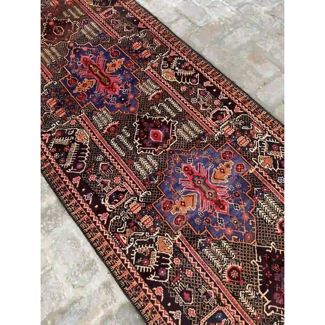 Style: Tribal Dimensions: 3.4 x 12.5 feet (103 x 380 cm) Condition: Vintage Colors: Rich red, deep blue, black, beige, and...