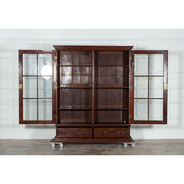 Circa 1880 large 19thc english mahogany glazed bookcase. Base w177 x d41 x h42 cm top w186 x d45 x h181 cm together w186 x...