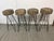 Design Plus Gallery presents a Set of Bar Stools from the Mid 20th Century. They have metal frames that are black with an...