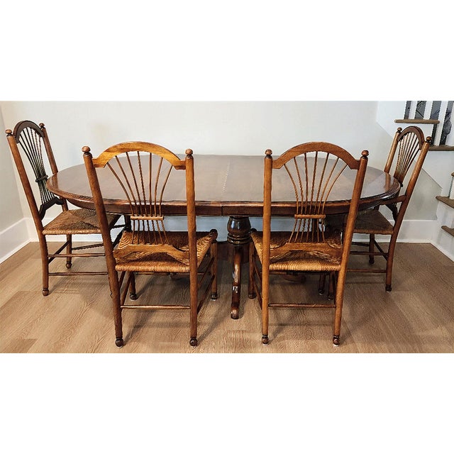 A superb and versatile Ethan Allen dining table from the renowned Heirloom Collection (Colonial Revival era). This table...