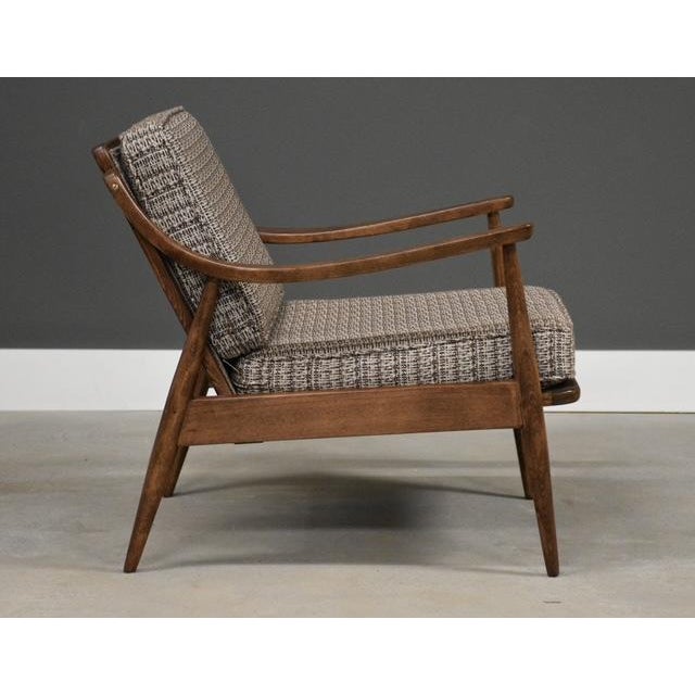 A mid century modern brown lounge chair. Refinished walnut color frame made of beech. Made in Denmark. Circa 1950’s. Seat...