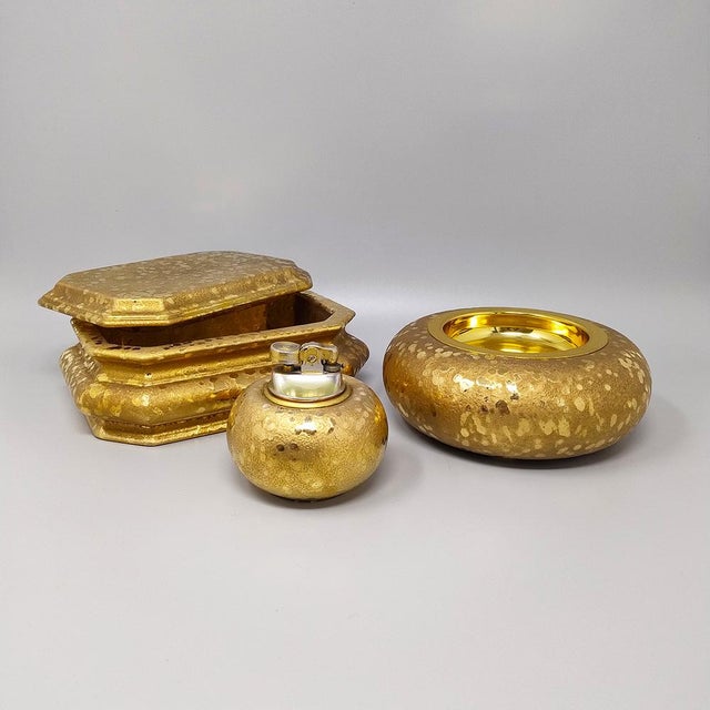 1970s exquisited handcrafted smoking set in ceramic and gold leaf. Made in italy. The table lighter works perfectly. This...