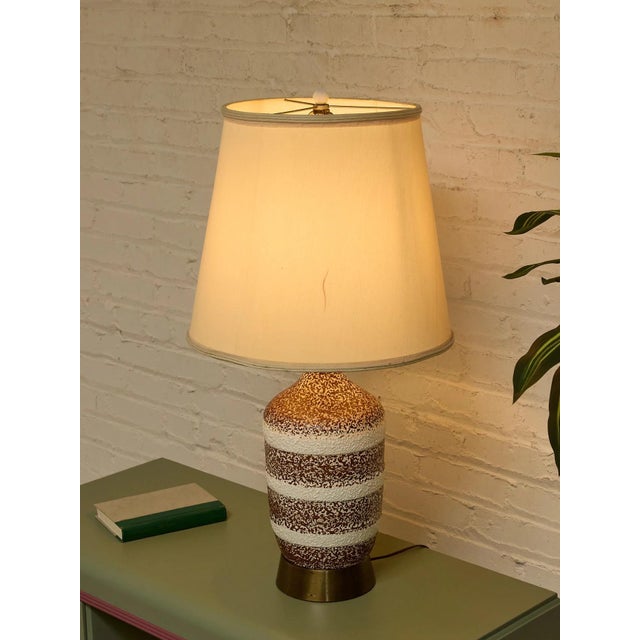 wonderfully tactile vintage table lamp with a rounded ceramic body finished in earthy brown and creamy white horizontal...