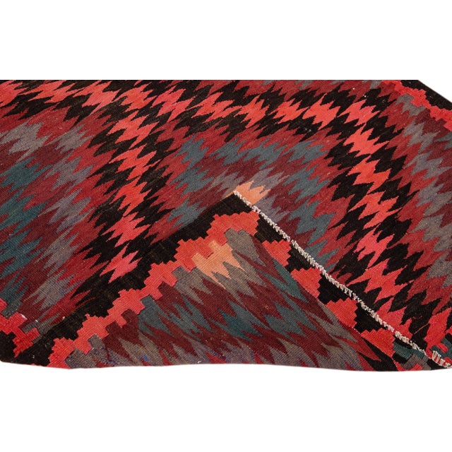 Beautiful vintage Turkish Kilim hand-knotted wool rug with a peach field. This piece has multicolor accents in an all-over...