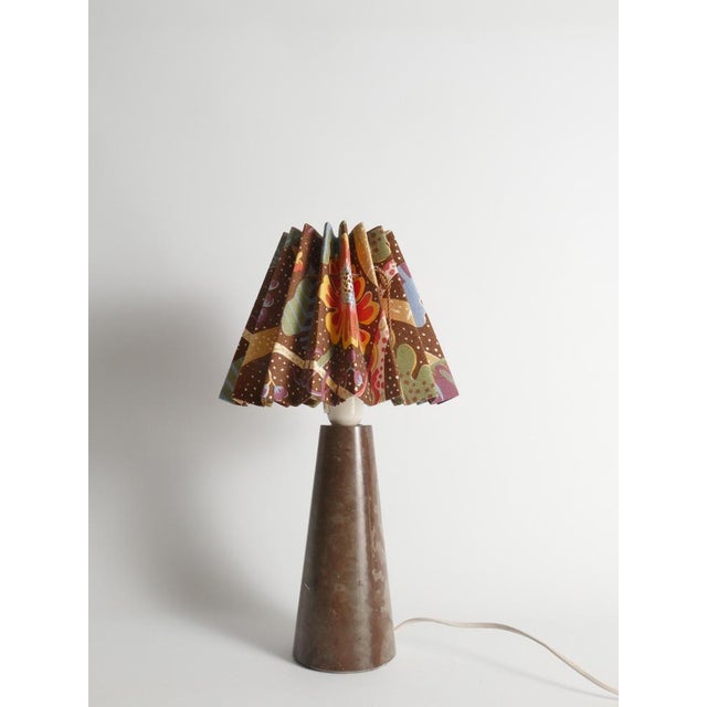 Brown stone table lamp in solid limestone (Öland limestone), Sweden, 1970s. Sculptural and substantial, the lamp base is...