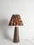 Brown stone table lamp in solid limestone (Öland limestone), Sweden, 1970s. Sculptural and substantial, the lamp base is...