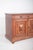 Oak sideboard with padded doors. A beautiful example of traditional joinery with a strong ornamental presence. The two...