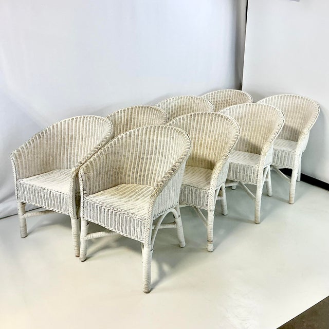 This is a set of 8 Wicker Dining Chairs from Palecek. They are a gorgeous weathered antique white club wicker chair. These...