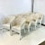 This is a set of 8 Wicker Dining Chairs from Palecek. They are a gorgeous weathered antique white club wicker chair. These...