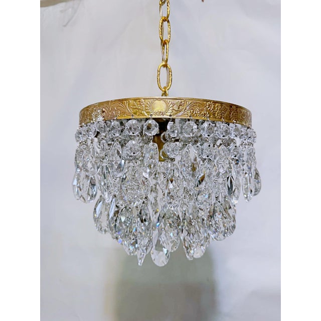 Bring the timeless opulence of a European salon into your home with this exquisite vintage crystal upside down chandelier....