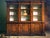 Handcrafted in Italy from solid walnut, this three-section library cabinet features an antique distressed finish and...