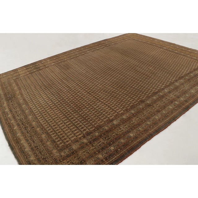 This 10x13 vintage Turkish Hereke Sivas rug, hand-knotted in wool circa 1950–1959, presents an elegant allover geometric...