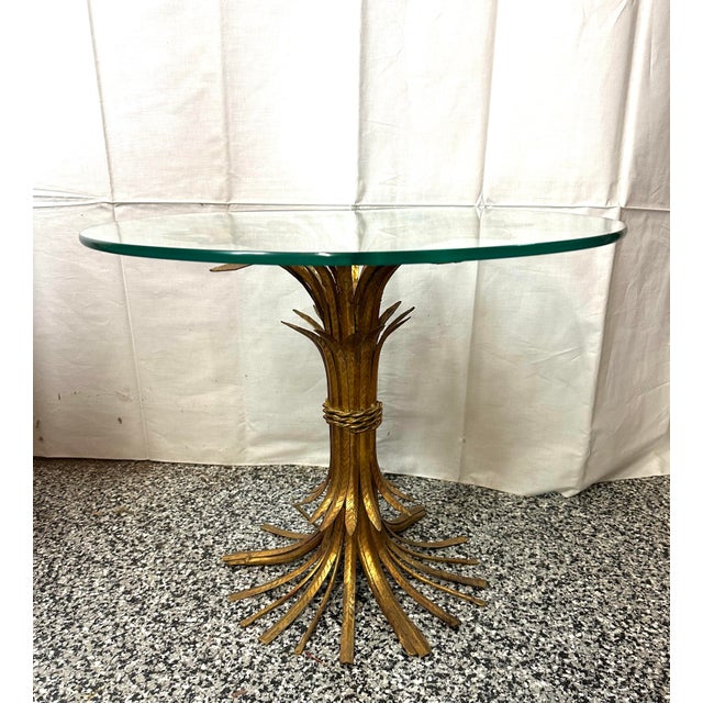 LaBarge Hollywood Regency style gold leaf wheat sheaf table with glass top. Circa 1960’s Made in Italy Measures 24” d...
