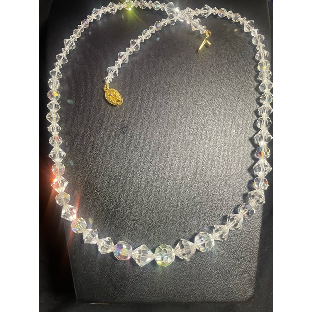 graduated, faceted glass crystal beads treated with an Aurora Borealis (AB) that gives the clear glass its characteristic...