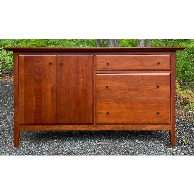 Solid cherry shaker style sideboard / credenza / media console. Exceptionally well made with three dovetailed drawers and...
