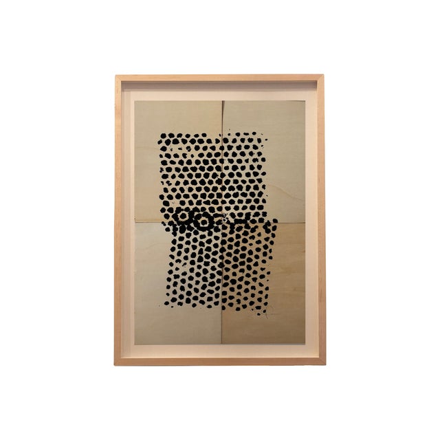 Modern abstract artwork featuring hand-applied black dot patterns on wood, arranged in a structured grid composition....