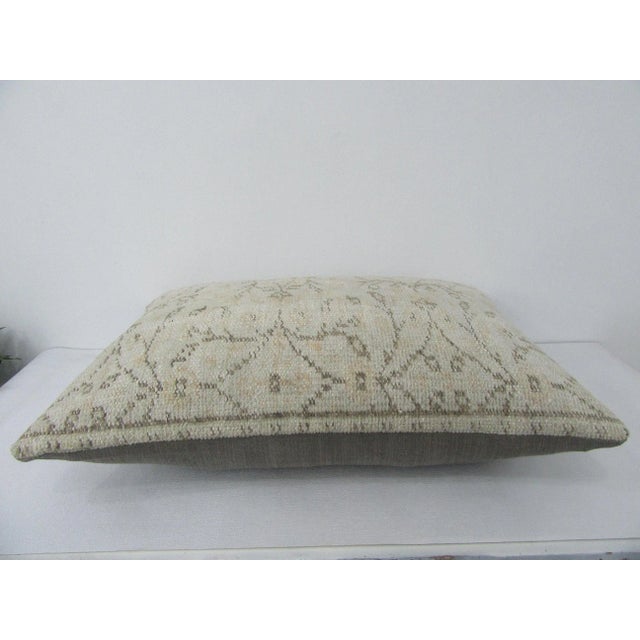 Decorative pillow cover made from a vintage Turkish handknotted rug. Backed with good quality cotton fabric. Pillow...