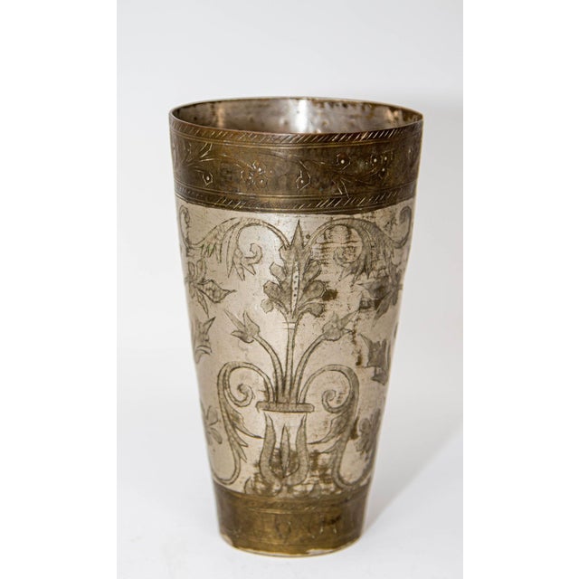 Antique hand hammered silvered metal engraved beaker beautifully hand chiseled and decorated with geometrical and...
