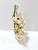 A charming vintage shell flower arrangement crafted from natural seashells and arranged in a large spiral conch shell...