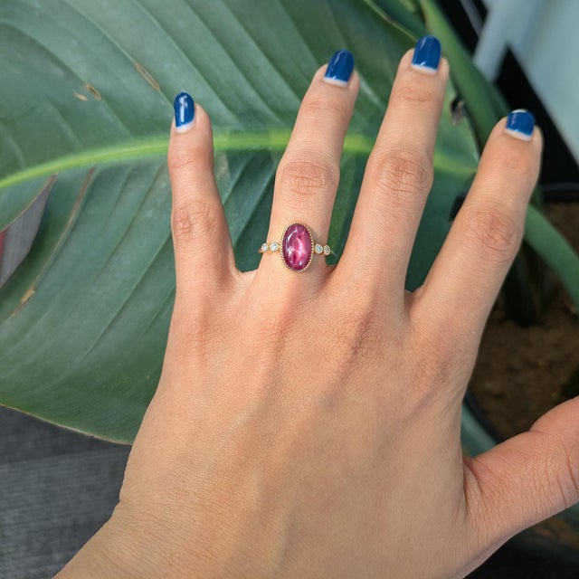 Bold and captivating, this ring features a 3.5ct star ruby with a mesmerizing natural star effect. Set in solid 14K gold...