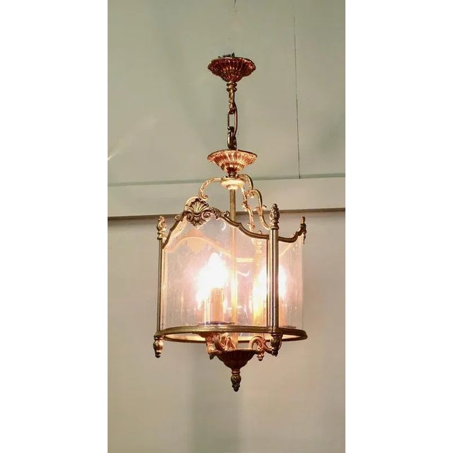 Large French Rocco Style Brass and Glass Lantern Hall Light A stylish Gilt Brass lantern, the light has three sides and...