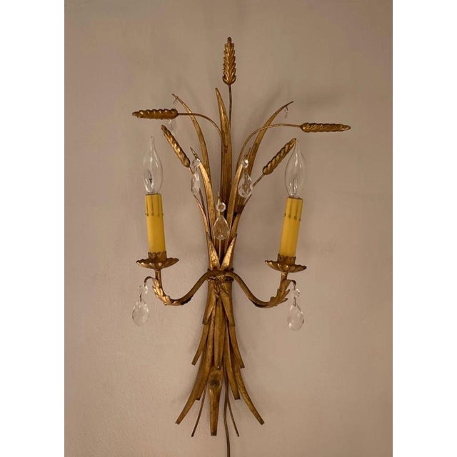 Pair of Italian wheat sconces with crystals. Currently US plug-in wired, could be hard-wired. Timeless and classic pair to...