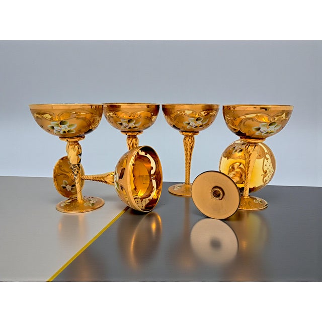 A set of six blown glass champagne flutes, a true jewel of Venetian craftsmanship, vintage from the 1960s, crafted using...