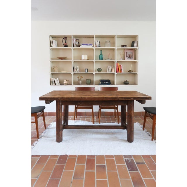 A French brutalist dining table attributed to the cabinetmaker Georges Robert, working in the 1960s in the same register...