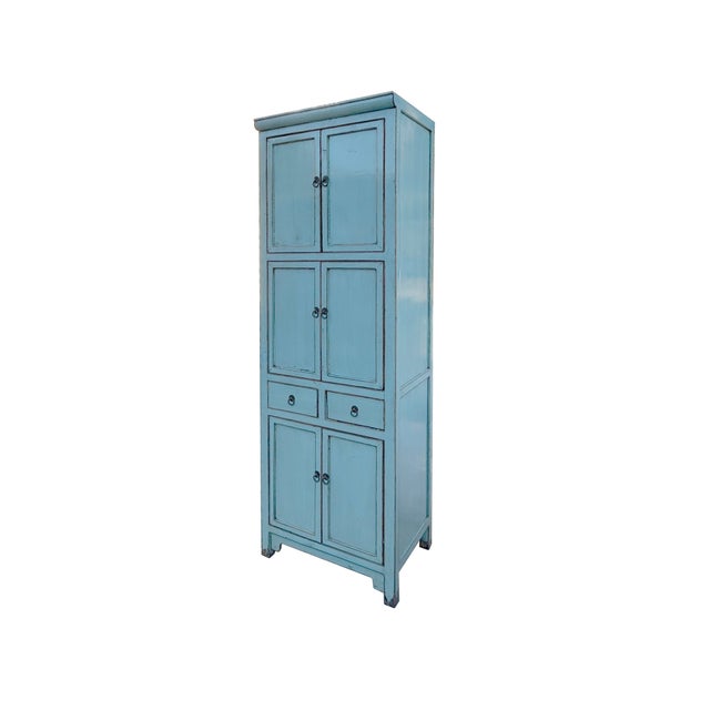 Bring a touch of vintage charm to your home with this elegant blue cabinet. Featuring multiple doors and drawers, this...