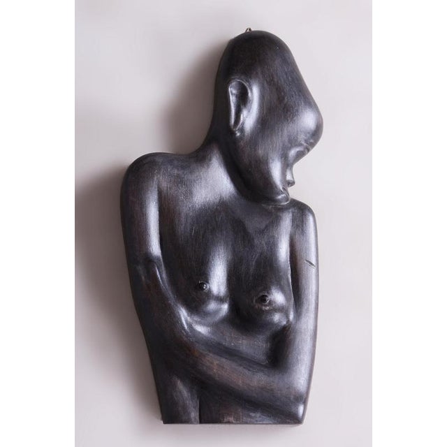 This impressive wood carving from the beginning of the 20th century represents a fascinating example of African art, which...