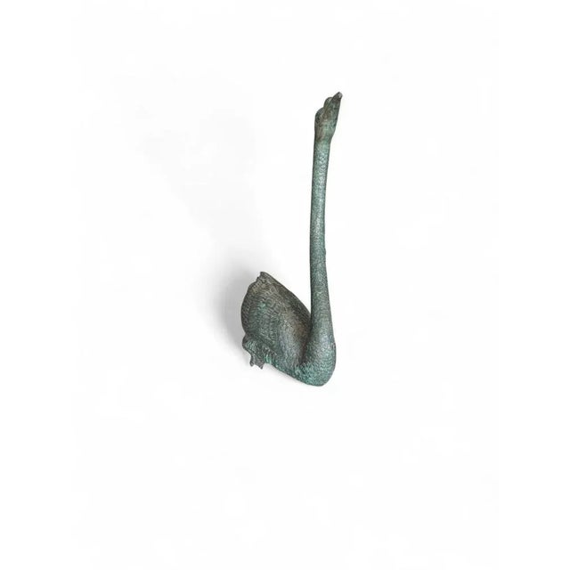 A graceful Spanish bronze sculpture from the 1950s, depicting a swan with elegant poise and naturalistic detail. The...