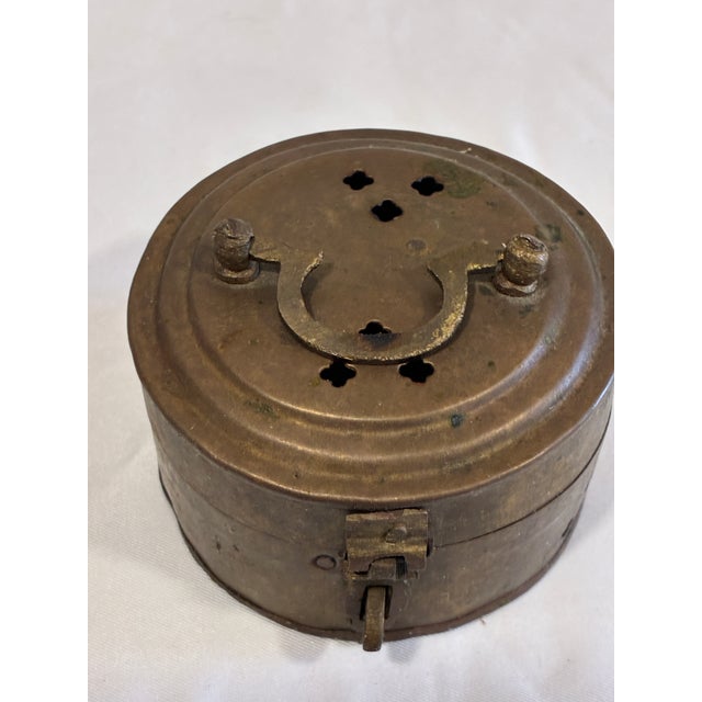 A fascinating vintage brass cricket box or incense burner handcrafted in India. This small cylindrical container features...