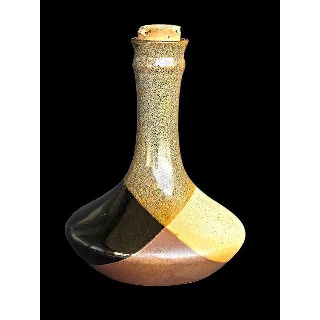 Offered is a mid 20th Century, circa 1970s Pottery Craft brand stoneware decanter with a cork stopper. Resembling a Genie...
