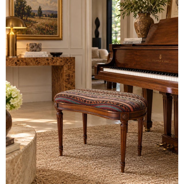 Elegant vintage French Provincial vanity stool or piano bench designed in the Louis XVI style. Featuring a distinctive...