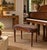 Elegant vintage French Provincial vanity stool or piano bench designed in the Louis XVI style. Featuring a distinctive...