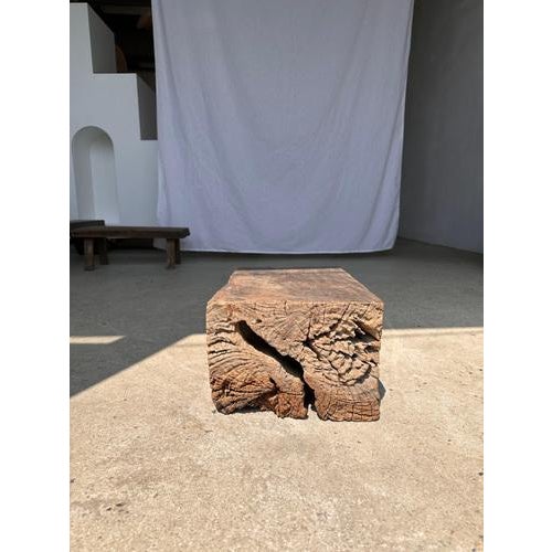 Stool in organic raw monoxyl Asian teak. The natural roughness of the wood (irregularities, holes, rings and cracks) gives...