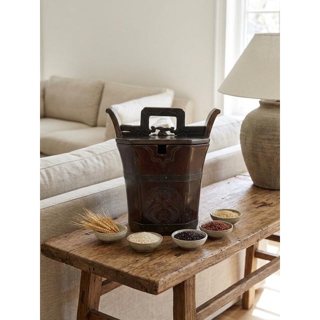 A Note for the Curators: This example retains all three original components (bucket body, octagonal lid, and carved slide-...