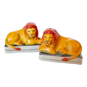 Antique Staffordshire Recumbent Lion Figurines on Rectangular Plinths - A Pair