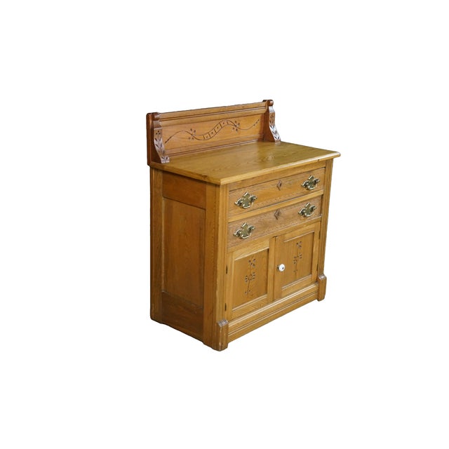 This exceptional antique Eastlake wood washstand commode (circa 1880) is expertly crafted from premium solid wood,...