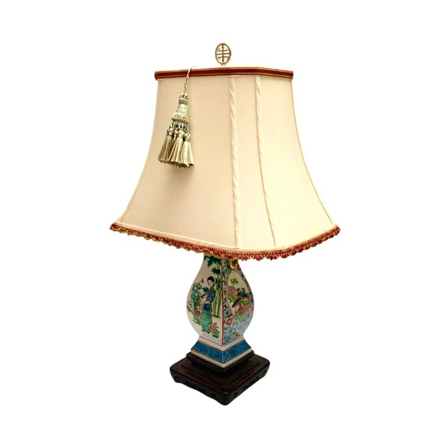 This oriental vintage hand-painted lamp on a wood base is a unique and elegant lighting fixture for any home. The...