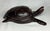 Vintage carved dark wood sea turtle figurine. Smooth satin texture with natural wood grains and variations.