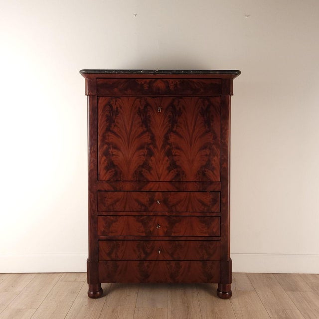 A Louis Philippe secretary abattant with original mottled black marble top, circa 1840.