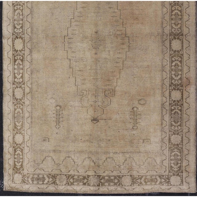 Measures: 5'4 x 9'3 Vintage Turkish Oushak Rug with Tribal/Floral Medallion Design in Tan and Taupe. Keivan Woven Arts /...