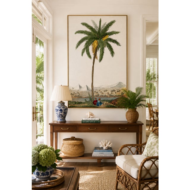Vintage botanical artwork reproduced and refined for modern printing. Featuring an elegant date palm rising above a serene...