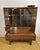 A stunning mid-century modern teak display cabinet by the renowned turnidge of london, dating from the 1960s–1970s....