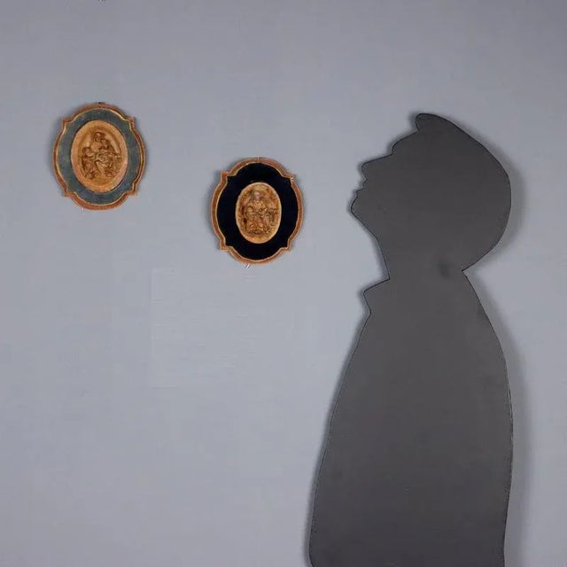 Pair of patinated plaster bas-reliefs depicting Jesus with Saint Joseph and Jesus welcoming the children. This piece is...